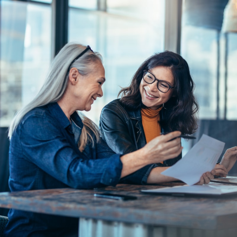 Two women reviewing documents