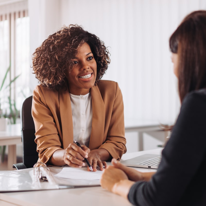 A woman interviewing someone for a job